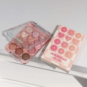 🎨 PALETA DE SOMBRAS “LOVE CALCULATOR” – 12 TONOS TIERRA & BRILLANTES | HERORANGE